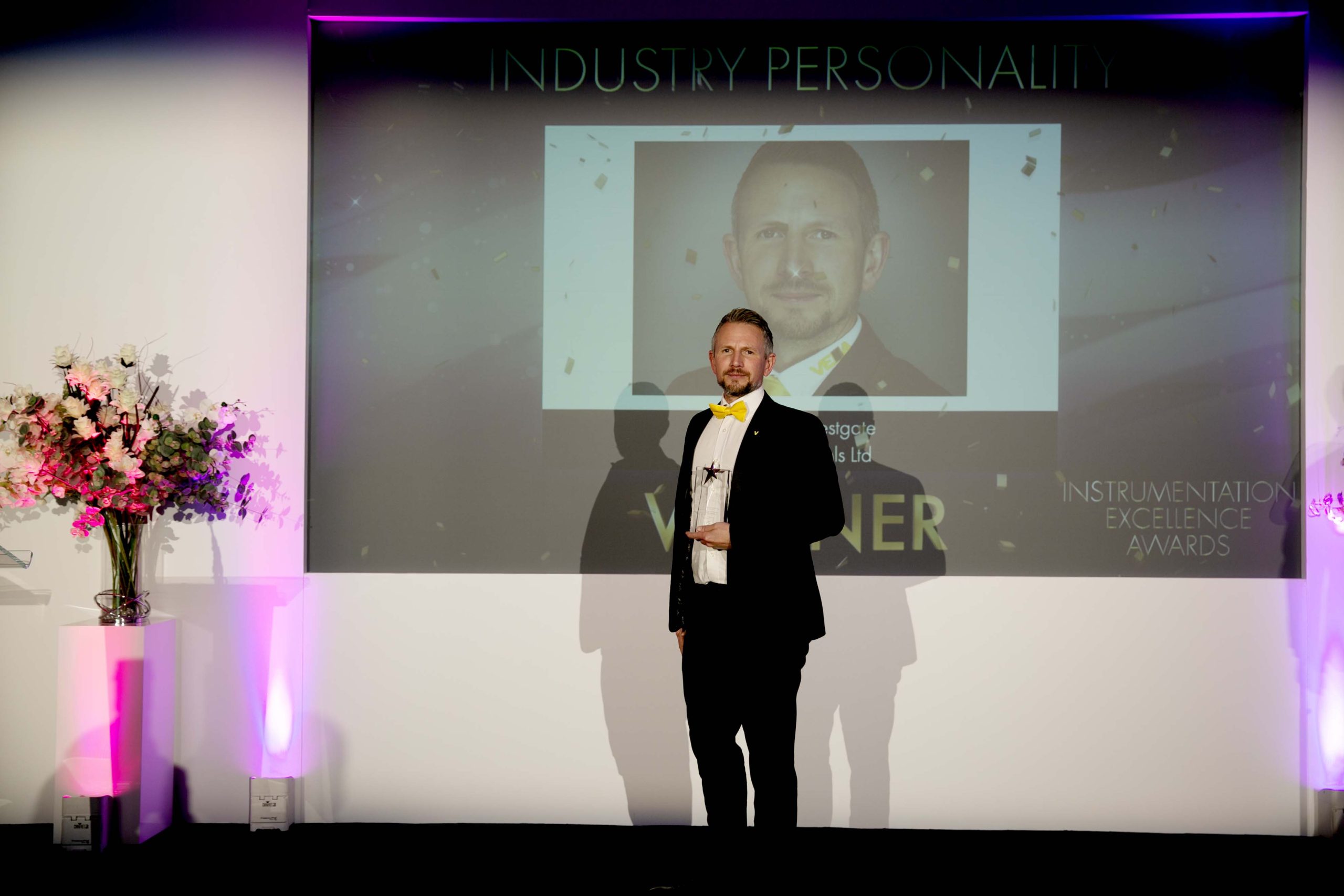 Matt Westgate accepting award posing smiling