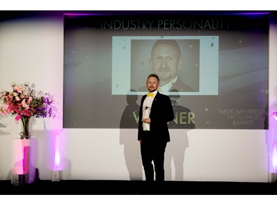 Matt Westgate accepting award posing smiling