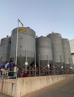 Multiple silos hold different varieties and grades of plastic pellets, all of which contribute to making different products.