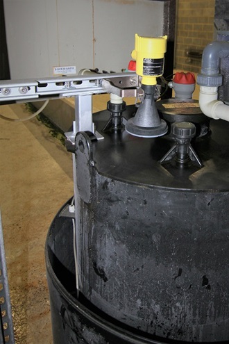 Acid and caustic day tanks with contactless radar