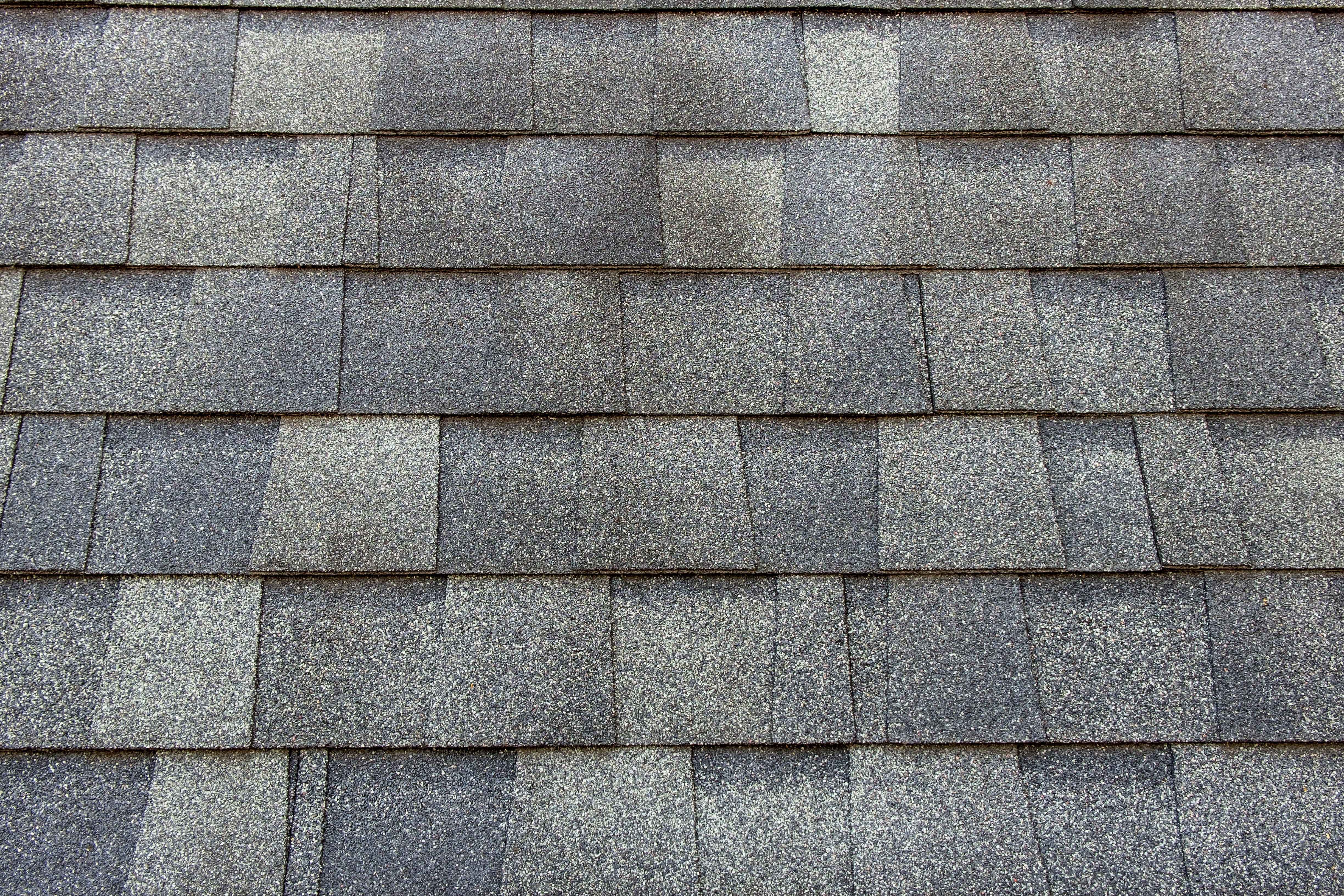Asphalt roofing shingles installed on a house